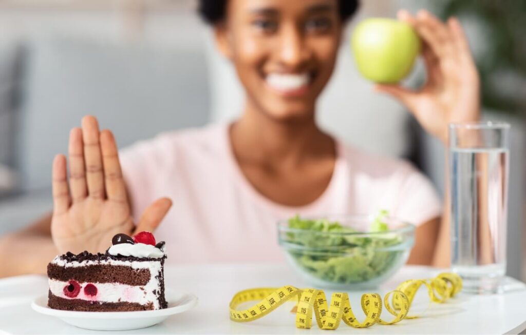 happy-black-woman-choosing-fresh-apple-over-unheal-2025-03-18-15-47-24-utc (1)