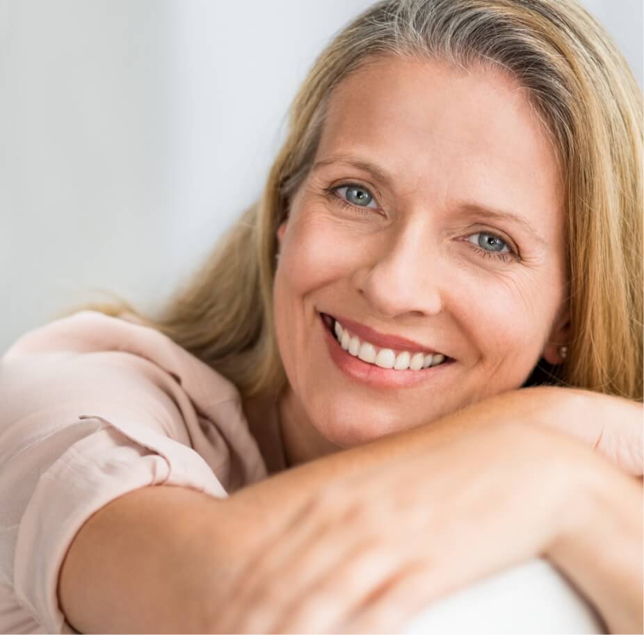 smiling-mature-woman-on-couch-2023-11-27-05-21-00-utc (1)