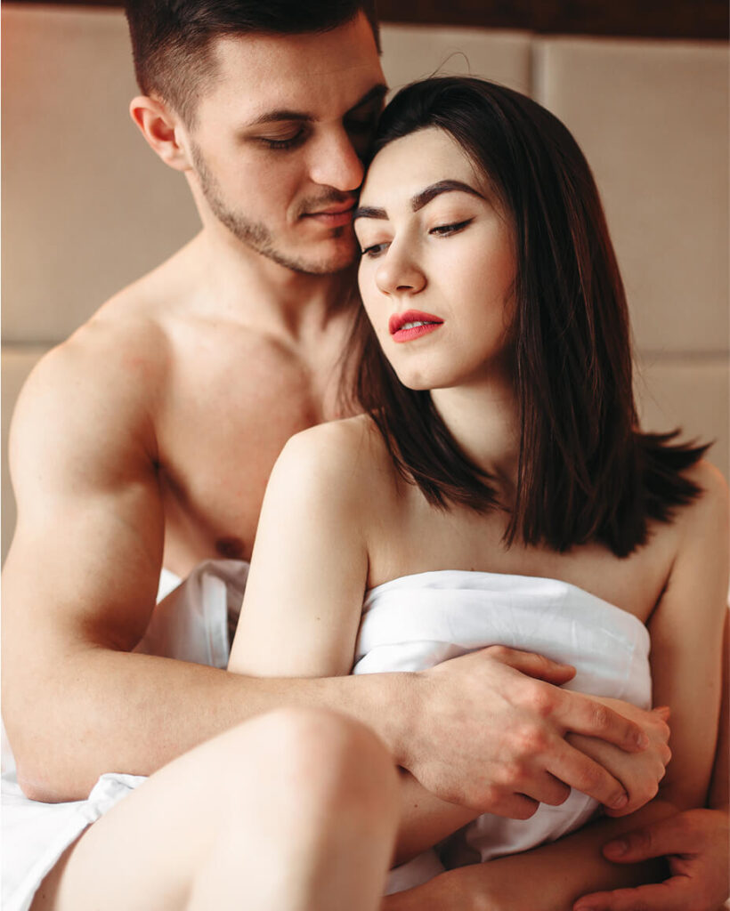 couple-hugging-on-big-white-bed-after-intimacy-2024-12-05-02-32-53-utc (1)