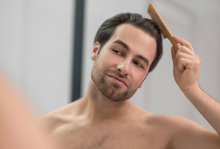 young-handsome-man-brushing-his-hair-and-looking-c-2024-10-16-23-23-08-utc (1) (2)